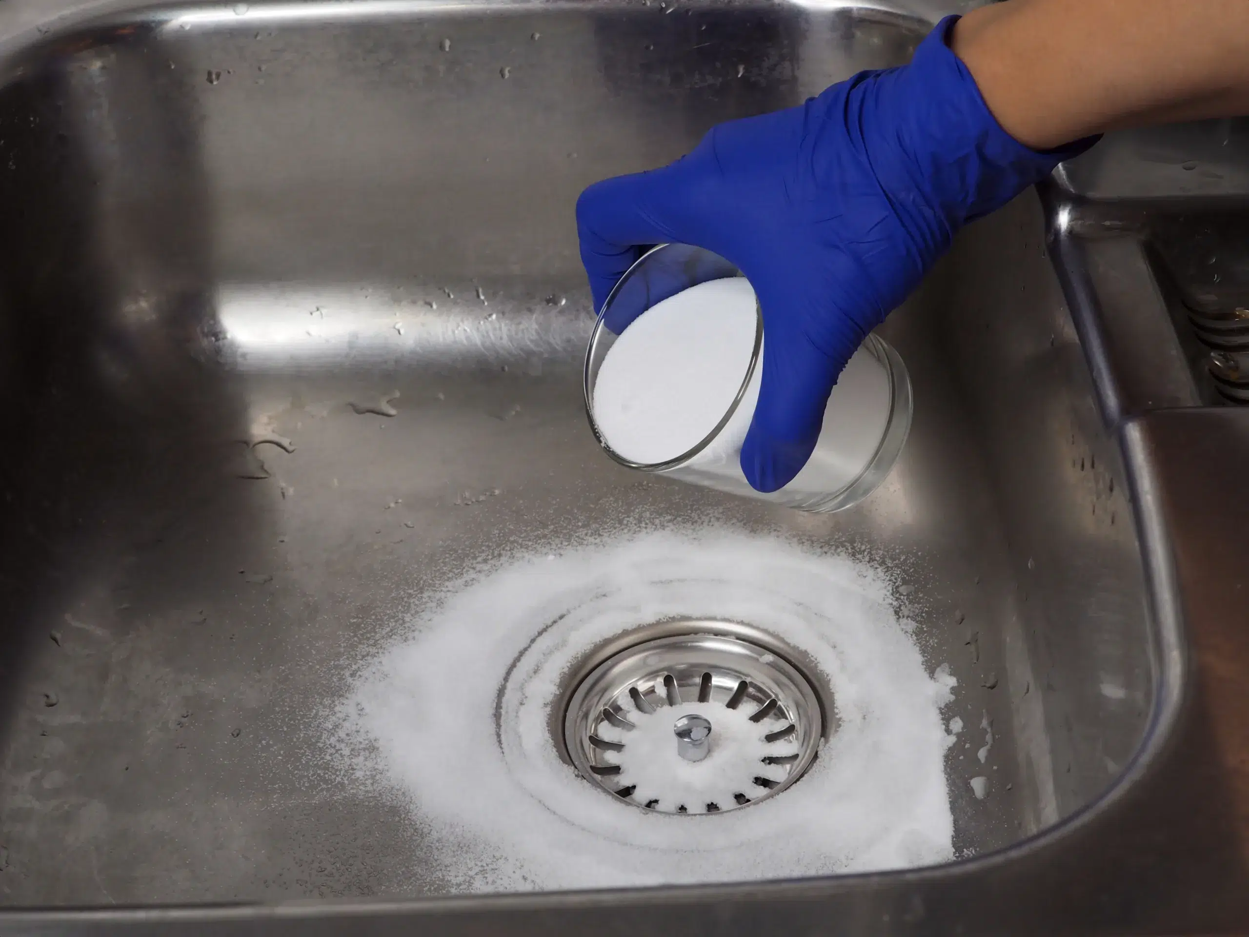 Spokane resident performing drain maintenance with backing soda